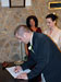 thumbnail of Groom signing